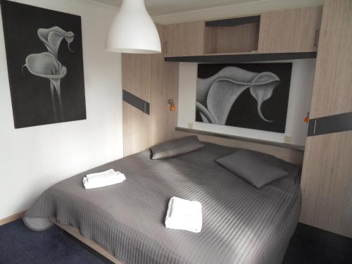 Säng eller sängar i ett rum på Hotel Montagna Delmondo