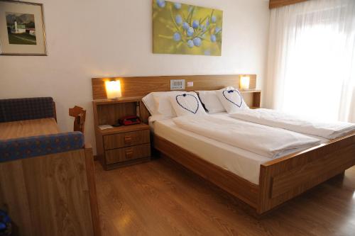 Postel nebo postele na pokoji v ubytování Hotel Sole Family Hotel