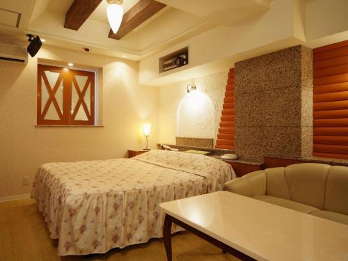Кровать или кровати в номере Hotel Fine Sakai