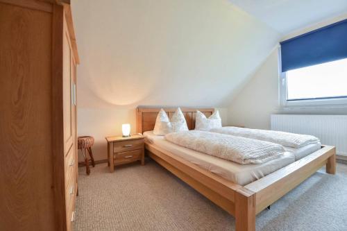 Кровать или кровати в номере Ferienhaus Inselnest
