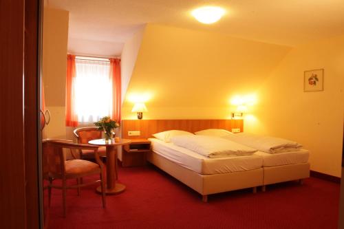 En eller flere senger på et rom på Hotel-Restaurant Zum Kirschbaum
