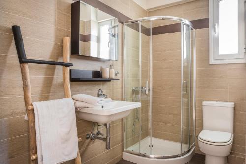a bathroom with a sink and a toilet and a shower at Deluxe Kefalonia Apartment Apartment Myrtillo 1 Bedroom Pool Sea View Karavomilos in Karavomylos