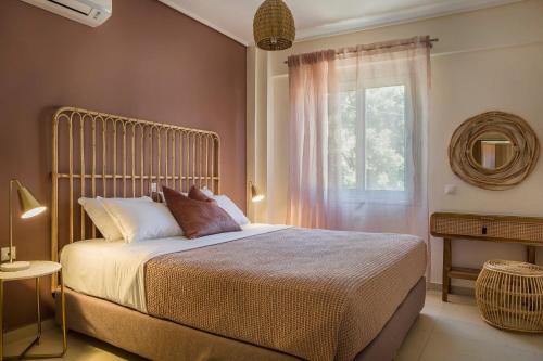 a bedroom with a large bed and a window at Deluxe Kefalonia Apartment Apartment Noufaro 1 Bedroom Pool Sea View Karavomilos in Karavomylos