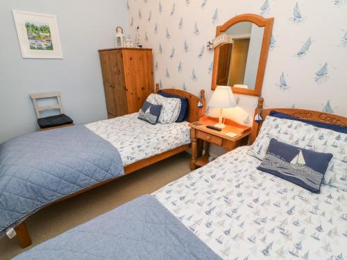 Postel nebo postele na pokoji v ubytování Nutkin Cottage
