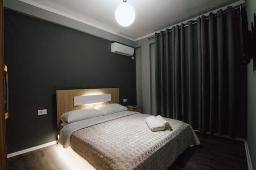 Ένα ή περισσότερα κρεβάτια σε δωμάτιο στο Novs Apartment 1