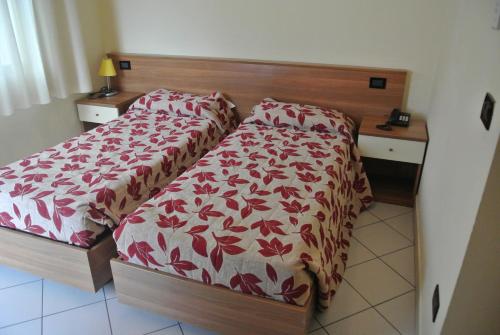 Säng eller sängar i ett rum på Arlecchino