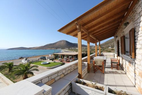 a house on the beach with a view of the ocean at Avgerinos Village in Agiassos