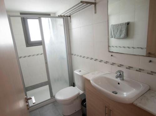 a bathroom with a toilet and a sink and a shower at Glabur Stays - The Nicosia Elite - Exceptional Top Floor Apartment Nicosia City, Welcomes U!!! in Nicosia