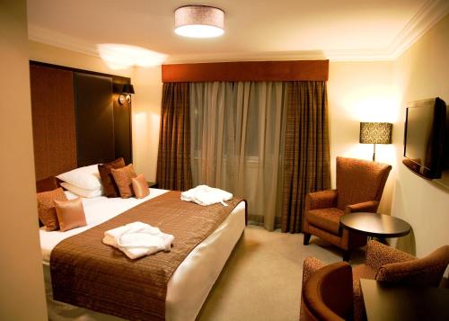 Ένα ή περισσότερα κρεβάτια σε δωμάτιο στο The Popinjay Hotel