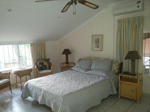 a bedroom with a large bed and a window at Boschfontein Guest Farm in Thabazimbi