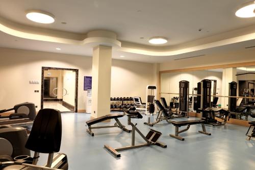 a gym with a lot of treadmills and ellipticals at Xanadu Island in Akyarlar