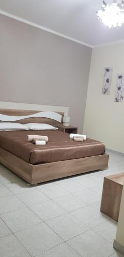 a hotel room with a bed and a desk at B&B AEREOSTATION in Lamezia Terme