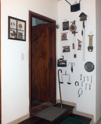 a room with a door and some items on the wall at Quito Eco Lodge Airport - B&B in Tababela