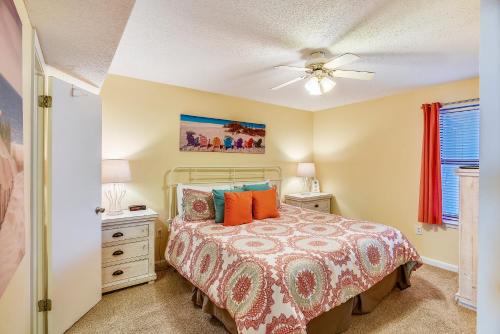 a bedroom with a bed and a ceiling fan at Phoenix 6 Unit 802 in Orange Beach