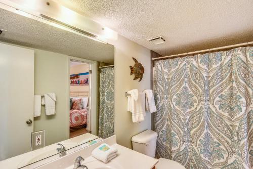 a bathroom with a shower and a toilet and a sink at Phoenix 6 Unit 802 in Orange Beach