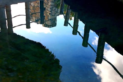 a reflection of the sky in a body of water at AXKAN PALENQUE, ALBERCAS, GASTRONOMIA MAR y TIERRA & TRAVEL AGENCY in Palenque