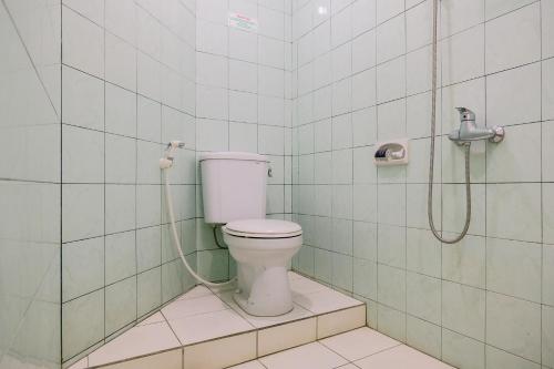 Een badkamer bij Hotel Taman Indah