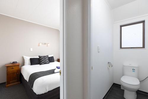 Postel nebo postele na pokoji v ubytování Kings Gate Motel