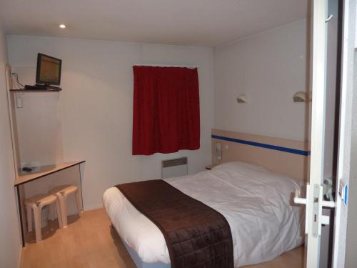 Katil atau katil-katil dalam bilik di Lac'Hotel France