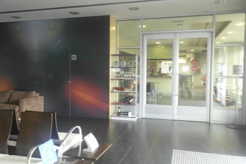 a store with glass doors and a table in a room at Gobeo Park in Vitoria-Gasteiz