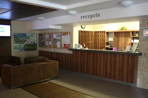 a lobby of a hospital with a reception counter at Fatrapark 2 Apartments HRABOVO - Hlavná recepcia in Ružomberok