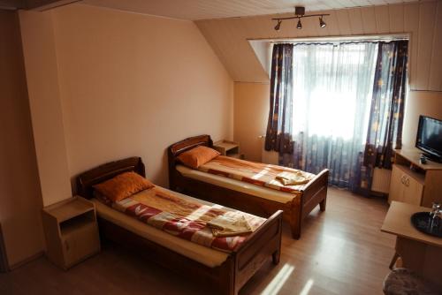 Postel nebo postele na pokoji v ubytování Hotel President Cugir