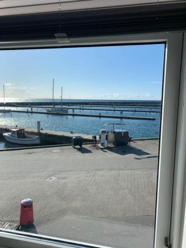 a view of a marina from a window at Pakhuset Anholt in Anholt