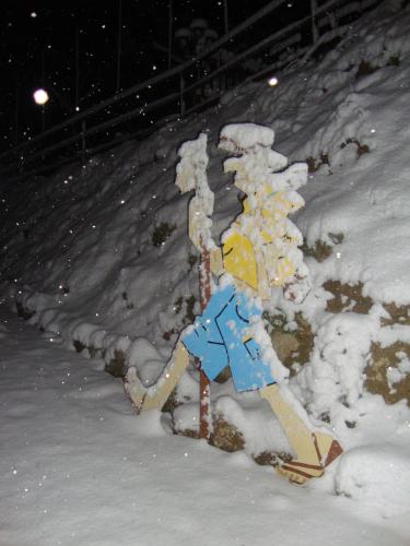 a statue of a man on skis in the snow at Hotel A Santiago in Belorado