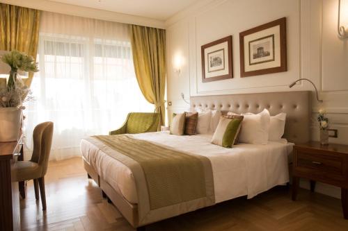 Un pat sau paturi într-o cameră la Grand Hotel Terme