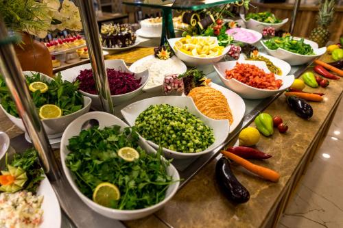 a buffet filled with lots of different types of vegetables at Esila Hotel in Ankara