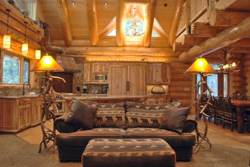 a living room with a couch in a cabin at 67 El Capitan in North Wawona
