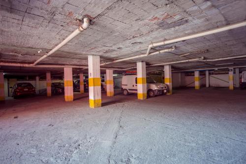an empty parking garage with cars parked in it at Hotel La Silla in Monterrey