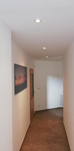 an empty room with a white wall at Ferienhaus Köhler in Marienberg