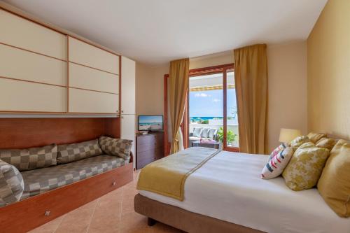 Ένα ή περισσότερα κρεβάτια σε δωμάτιο στο Conturana Residence