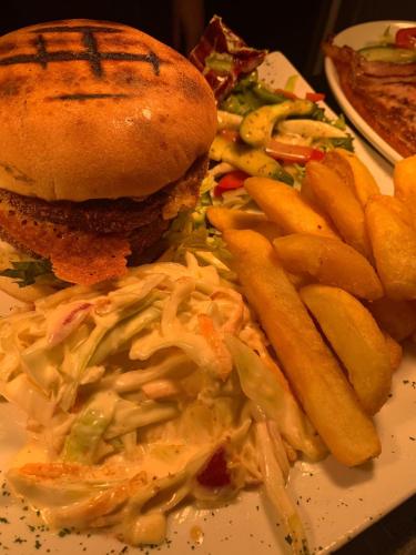 a plate of food with a sandwich and french fries at The Parkers Arms - The home of Cattlemans Steakhouse in Paignton