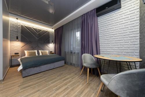 Кровать или кровати в номере Tomas apartments
