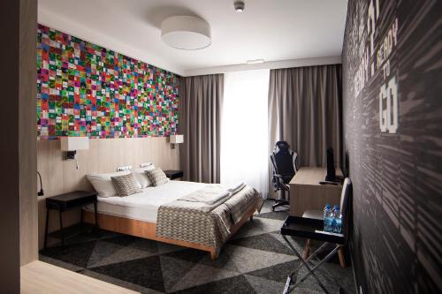 Postel nebo postele na pokoji v ubytování Hotel Jan Sander