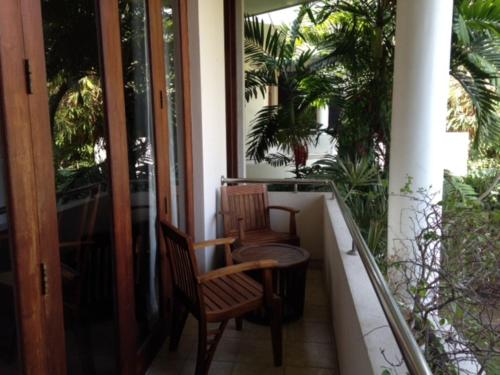 two chairs and a table on a balcony at Silvikris Villa in Colombo