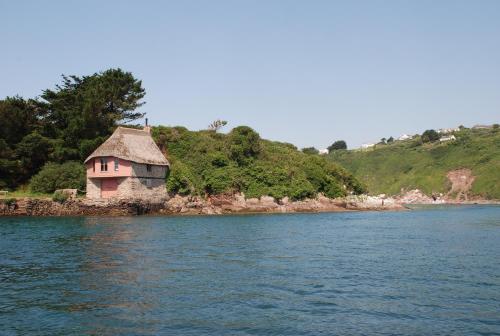 an island in the middle of a body of water at Church House Inn, Churchstow in Kingsbridge