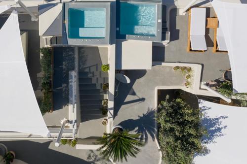 an overhead view of a building with a swimming pool at Edem Boutique Suites in Oia