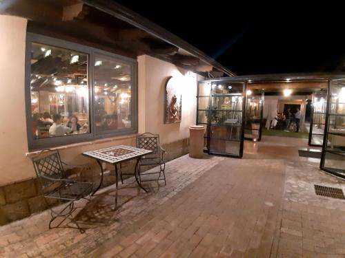 a patio with a table and chairs next to a building at locanda della pacchiana in San Salvatore Telesino