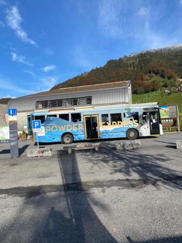 a bus parked in front of a gas station at Luxury family apartment Engelberg in Engelberg