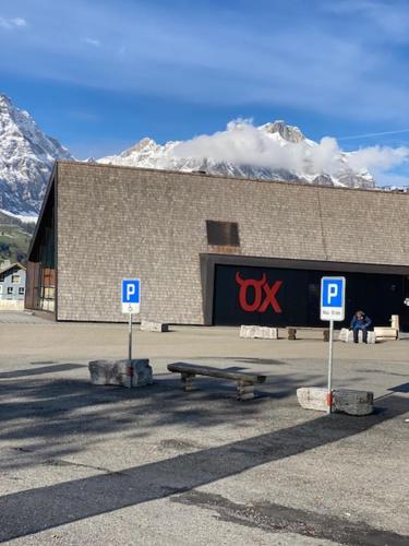 a building with a largex sign in front of it at Luxury family apartment Engelberg in Engelberg