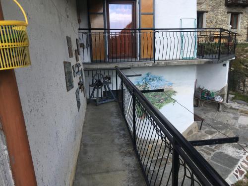 a stairway with a railing and a balcony at Casa Miki in Roure Turin