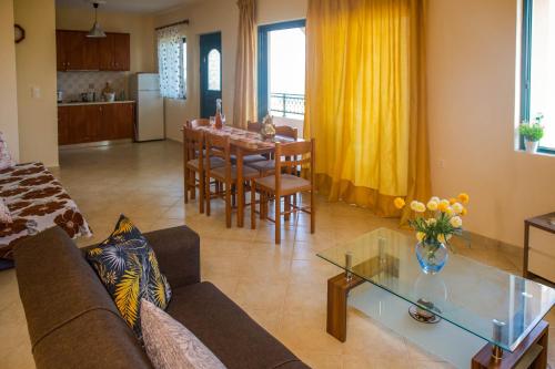a living room with a couch and a table at Betsis Apartments in Kipseli