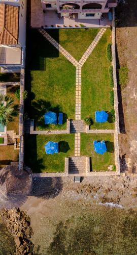 an aerial view of a yard with two blue tents at Betsis Apartments in Kipseli