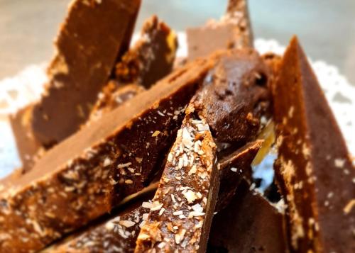 a close up of a pile of chocolate bars at Kyriad Hotel Lyon Givors in Givors