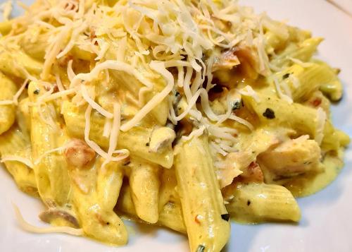 a plate of pasta with cheese and meat at Kyriad Hotel Lyon Givors in Givors