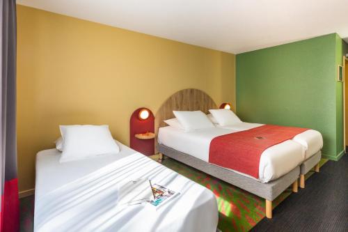 Un ou plusieurs lits dans un hébergement de l'établissement Ibis Styles Arlon Porte du Luxembourg