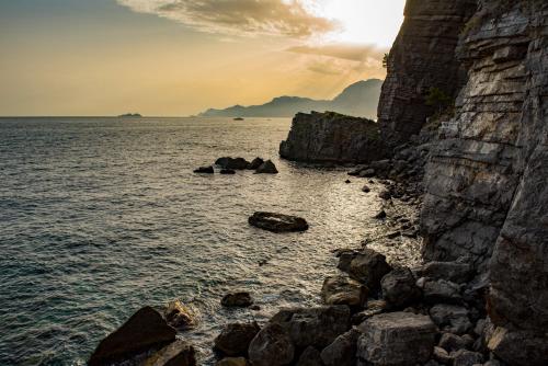 a view of the ocean with rocks in the water at Grand Hotel Tritone in Praiano